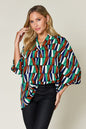 Double Take Full Size Geometric Notched Raglan Sleeve Blouse